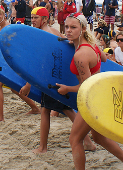 Santa Cruz Jr. Guard Captain Corps teens on the beach with surfboards
